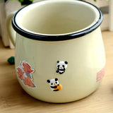 stickers muraux panda colles sur une tasse